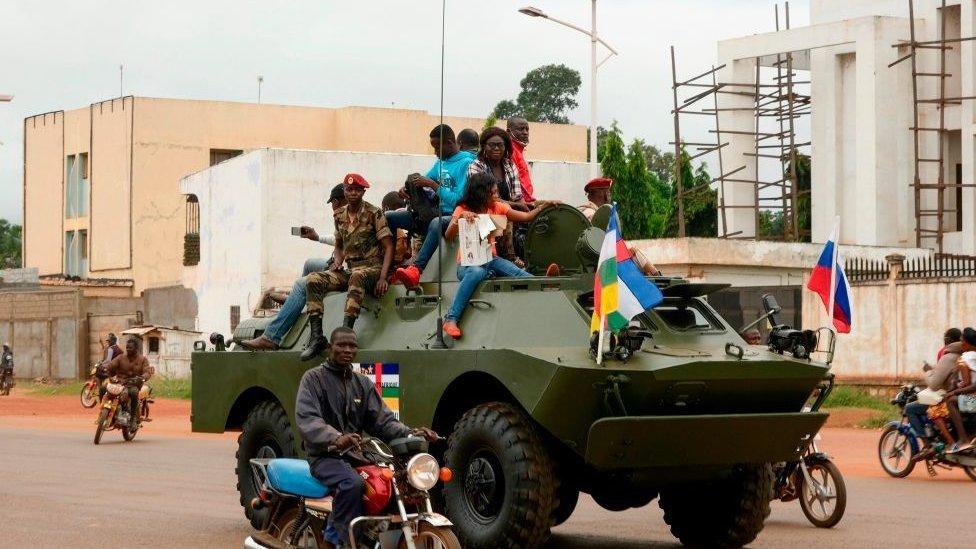 A Russian armoured personnel carrier (APC) is seen driving in the street during the delivery of armoured vehicles to the Central African Republic army in Bangui