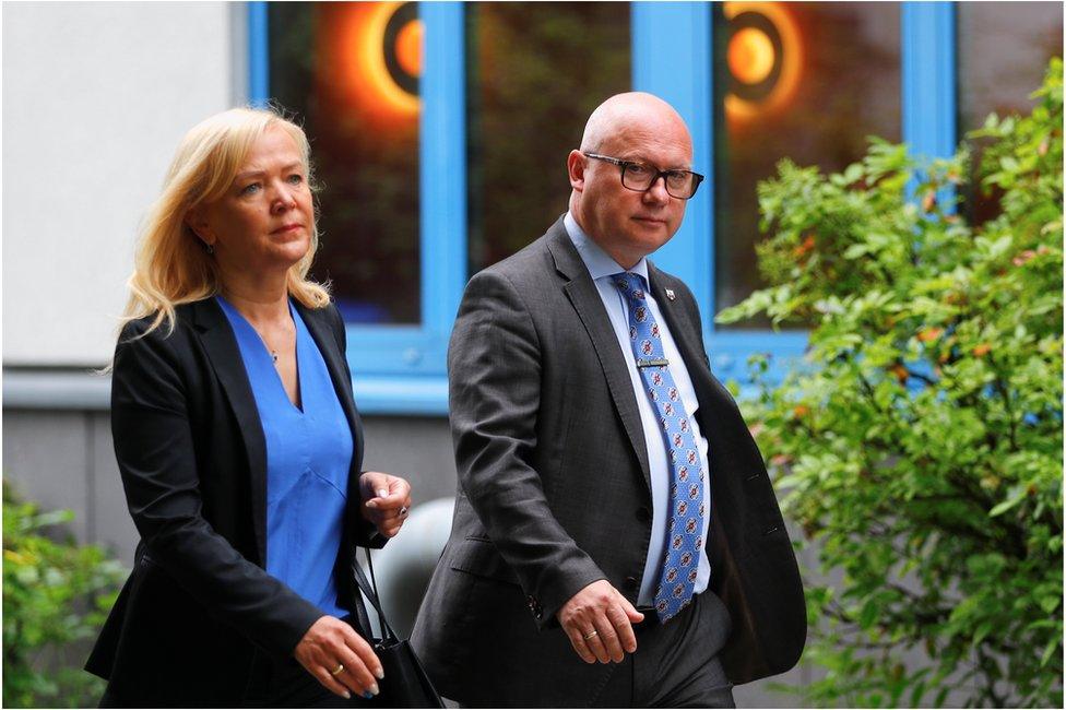 Oliver Kirchner, the top candidate of the far-right AfD (Alternative fuer Deutschland) party, and his wife Tatiana arrive to cast their votes for the federal state election of Saxony-Anhalt, in Magdeburg, Germany, June 6, 2021