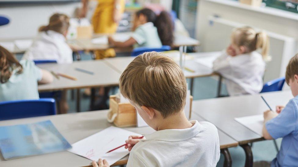 Children sitting in a classroom