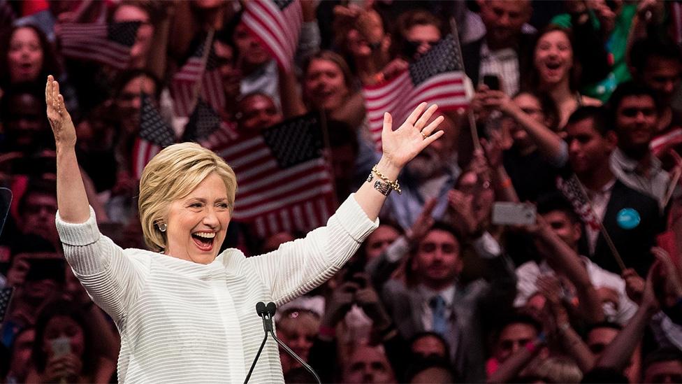 Hillary Clinton celebrating her win with her arms in the air