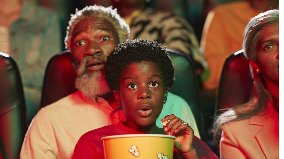 young-boy-with-granddad-at-cinema