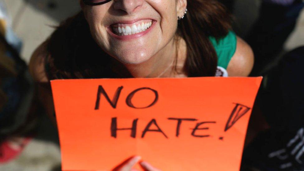 "No hate" protest sign