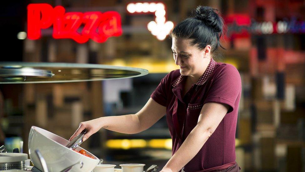 Staff serving salad at Pizza Hut