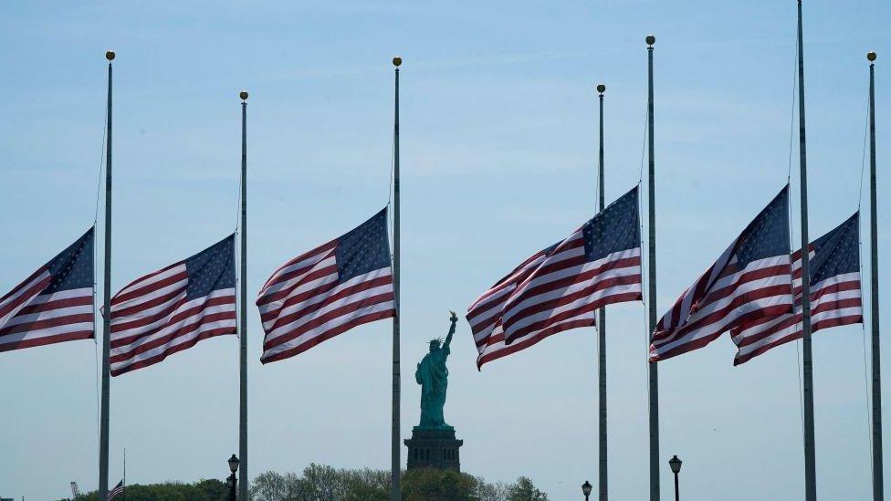 US flags fly half mast