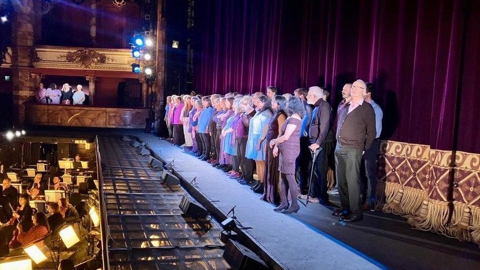 The choir performing at the Coliseum in London