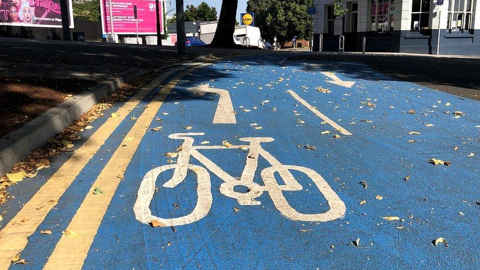 Bike painted on a blue cycle lane