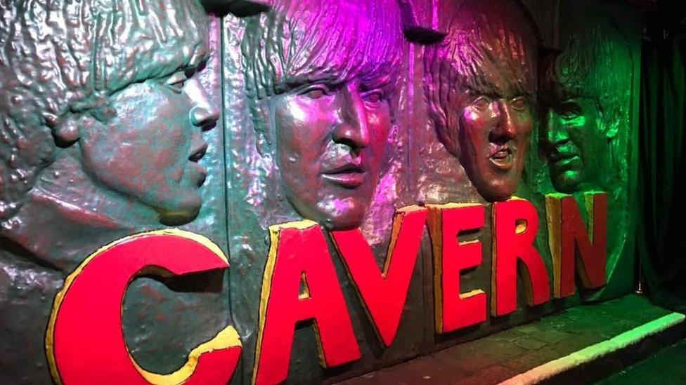 Sculpted wall tribute to the Beatles on a wall in the Cavern Club