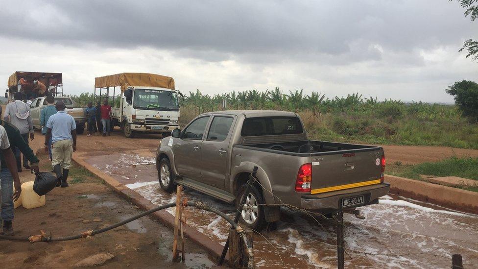 Truck driving through disinfectant bath