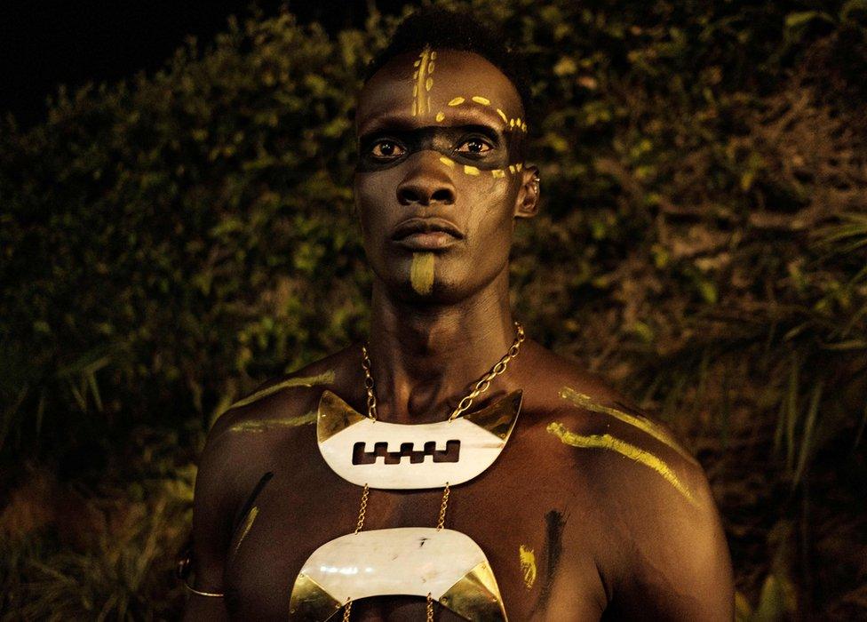 A model poses in the backstage before Burundi"s Margaux Wong collection during the 6th Kampala Fashion Week, the annual showcase of fashion brands from East Africa, in Kampala, Uganda, on September 28, 2019