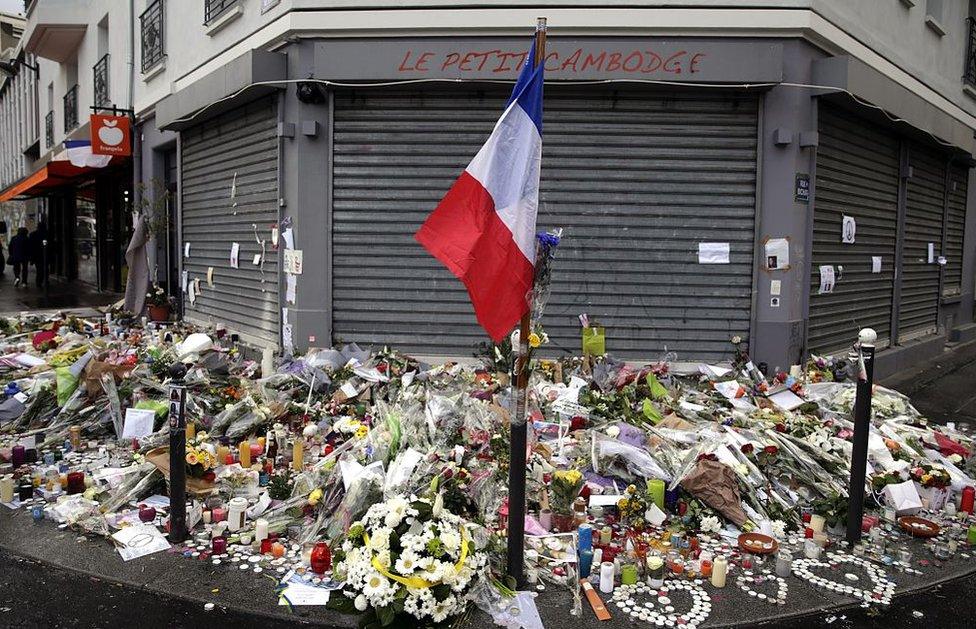 Flowers left outside Le Petit Cambodge in Paris, site of a shooting in November 2015