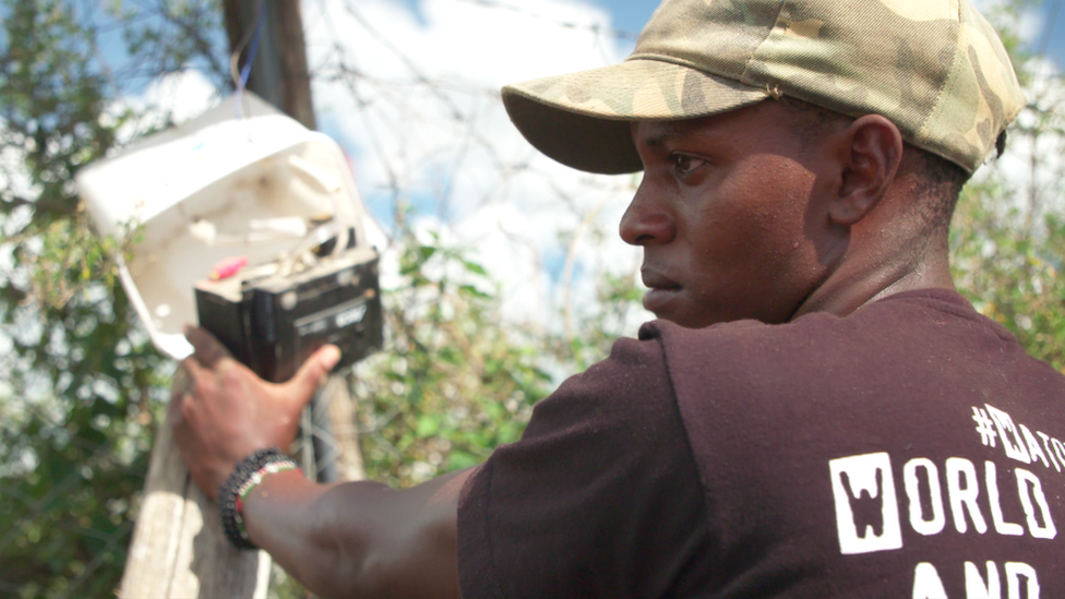 Richard Turere installing the lion lights