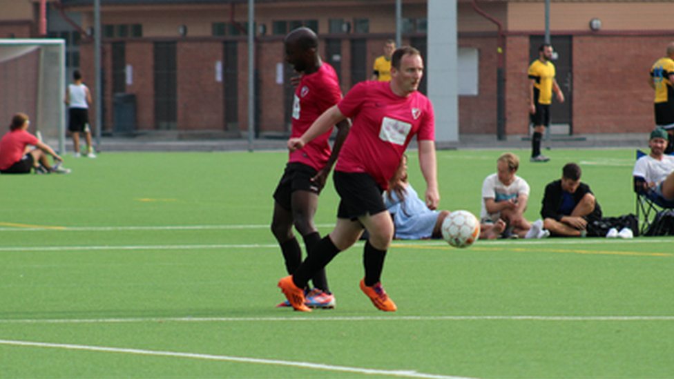 Anthony Smith playing football