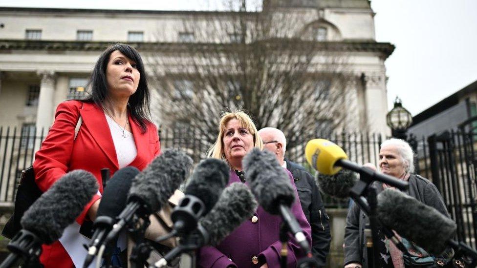 Grainne Teggart, Amnesty International UK’s Deputy Director for Northern Ireland (L), Martina Dillon (2nd L) whose husband, Seamus, was shot and killed outside the Glengannon Hotel in Dungannon on 27 December 1997.