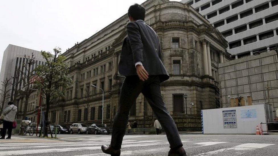 BOJ building and man walking past it