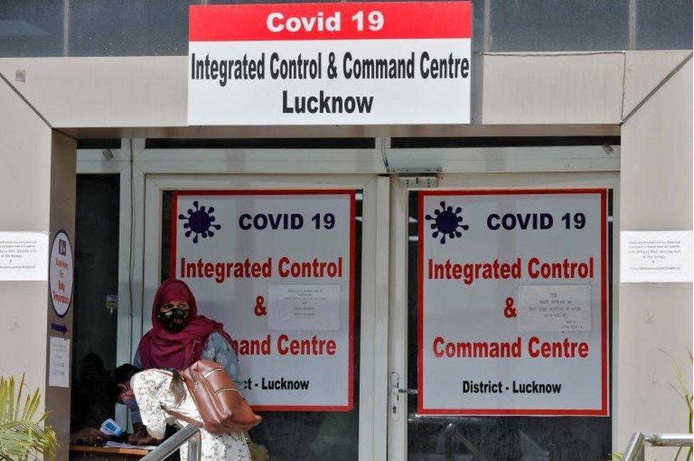 A woman registers details to get a hospital bed for her relative who needs treatment for the coronavirus disease at the COVID-19 Integrated Control and Command Centre in Lucknow, India, April 20, 2021.