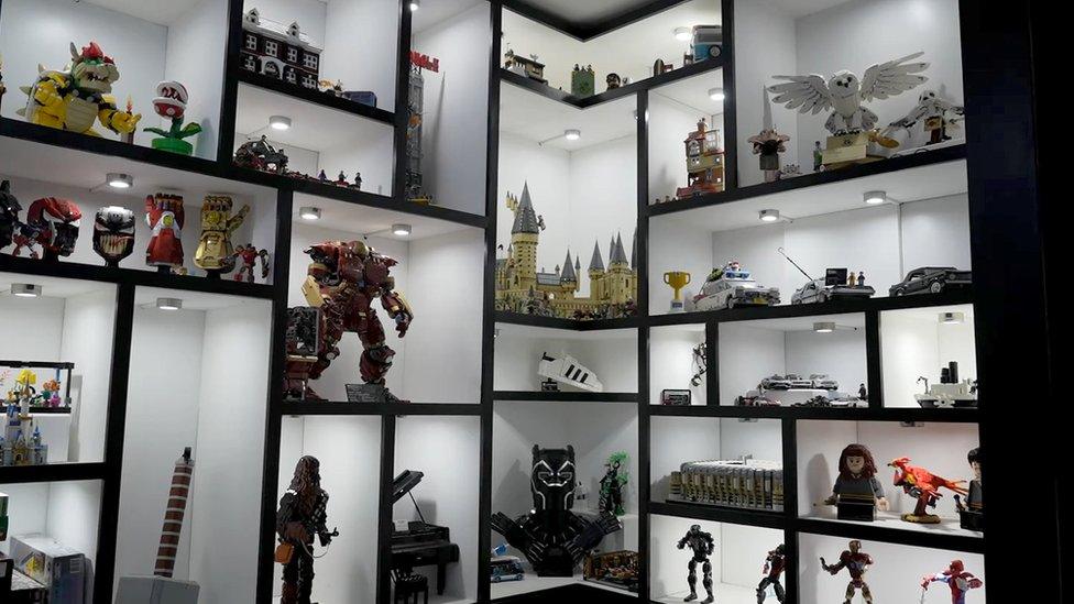 Shelves complete with Lego from all parts of pop culture.