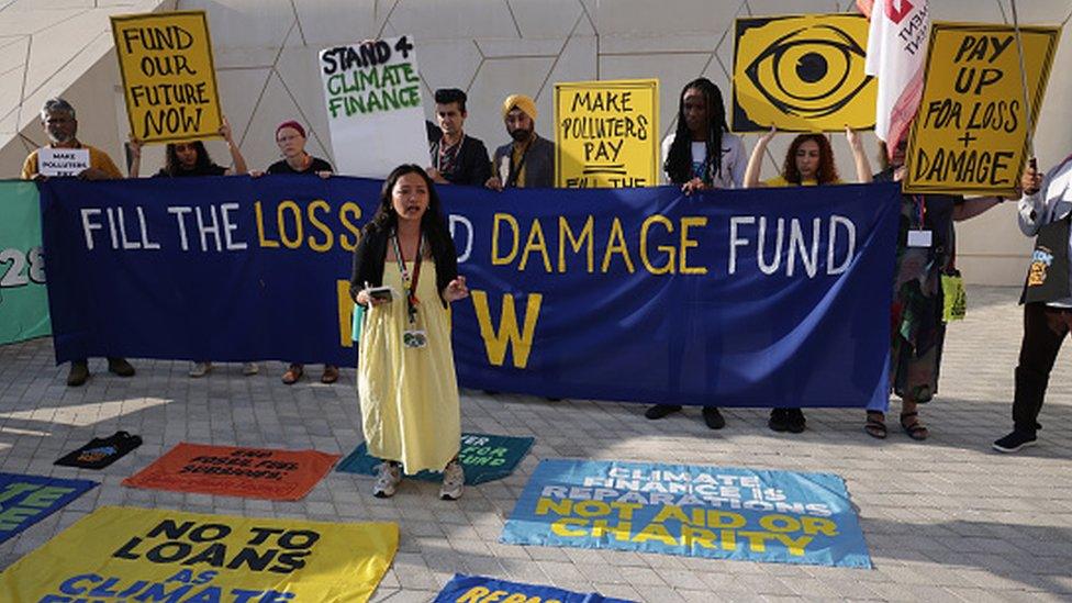 Protesters demand payouts by rich countries in loss and damage compensation on day five of the UNFCCC COP28 Climate Conference at Expo City Dubai on December 04, 2023 in Dubai, United Arab Emirates.