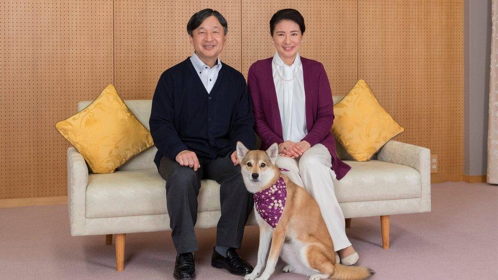 Japan's Crown Prince Naruhito and Crown Princess Masako pose for a photograph with their pet dog Yuri, 4 December 2018