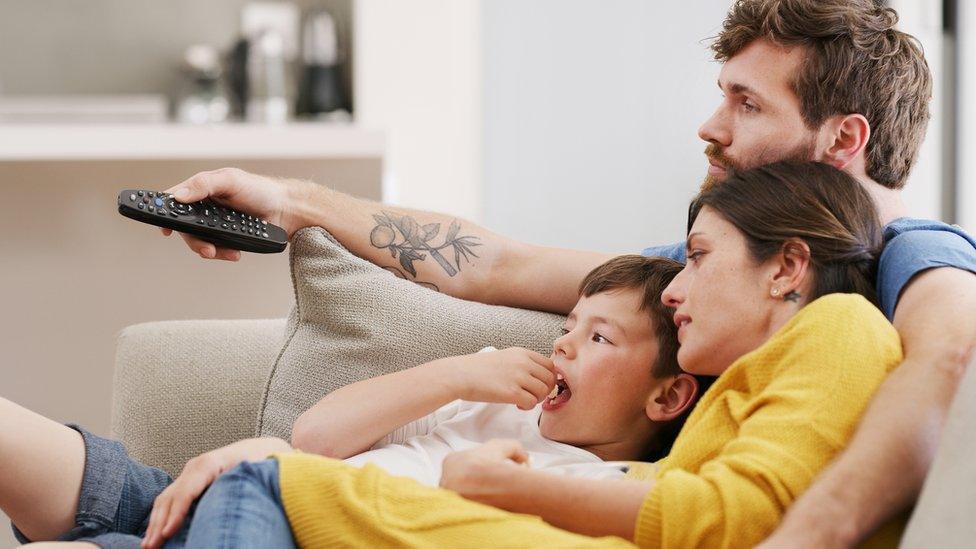 Family watching TV