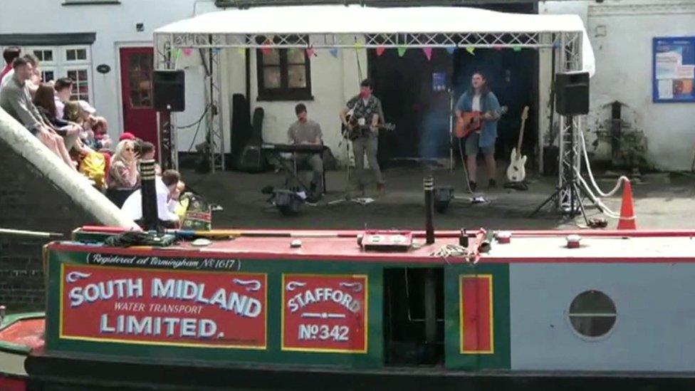 Band playing beside the canal