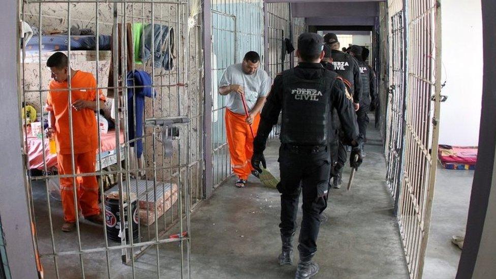 A handout picture provided by the Government of Monterrey shows police officers conducting a search in the Topo Chico Prison in Monterrey, Mexico on 14 February 2016