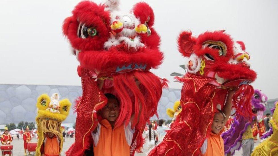 Chinese youth lion dancers rehearse for a Winter Olympics bid show in Beijing. Photo: 30 July 2015