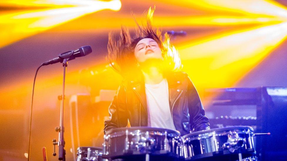 Lauren playing the drums