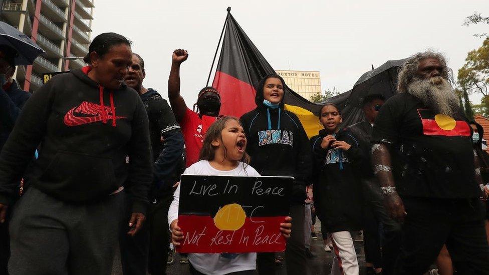 Protesters march down St Georges Terrace following a Black Lives Matter rally at Langley Park on June 13, 2020 in Perth, Australia