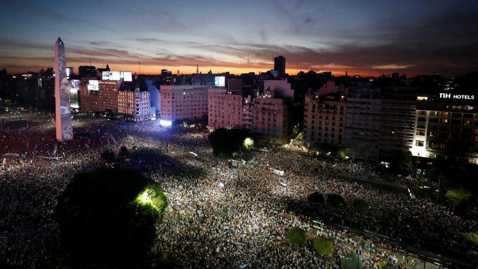 Argentina fans celebrate winning the World Cup at the Obelisk with an image of Lionel Messi REUTERS/Agustin Marcarian TPX IMAGES OF THE DAY