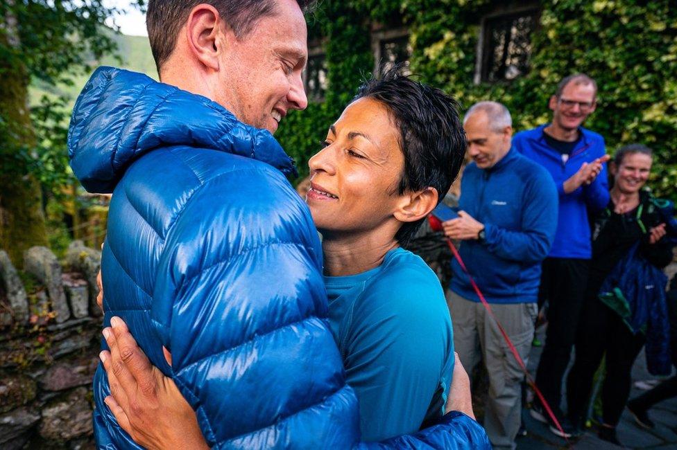 Sabrina Verjee hugging her husband Ben Turner after finishing