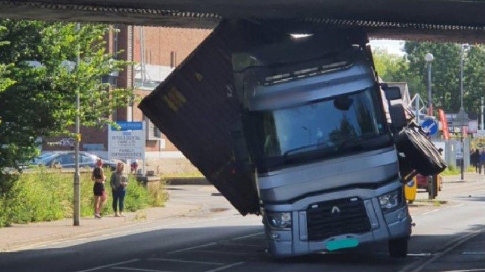 Lorry stuck under railway bridge