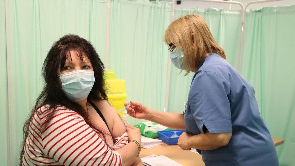 Woman getting vaccinated