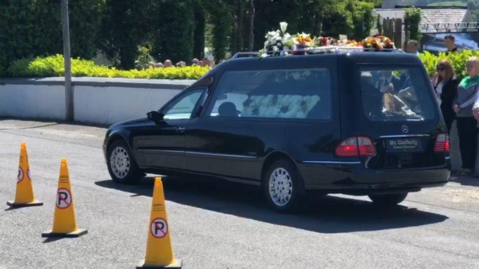 The hearse which carried the remains of Manus Kelly arriving at St Columba's Church, Glenswilly