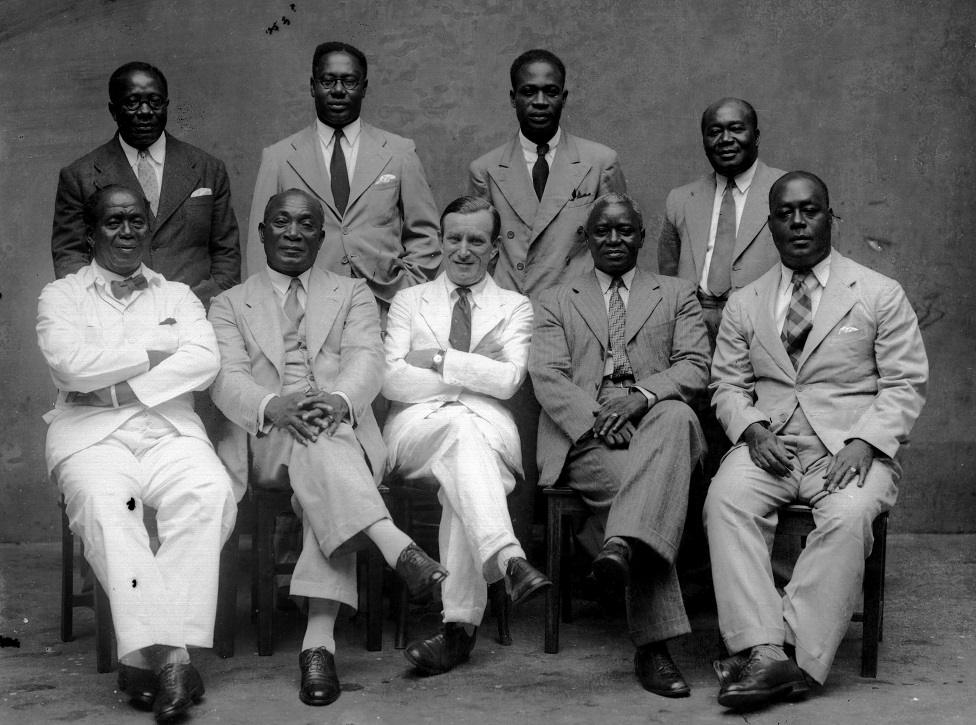 A group of men formally arranged for a photograph