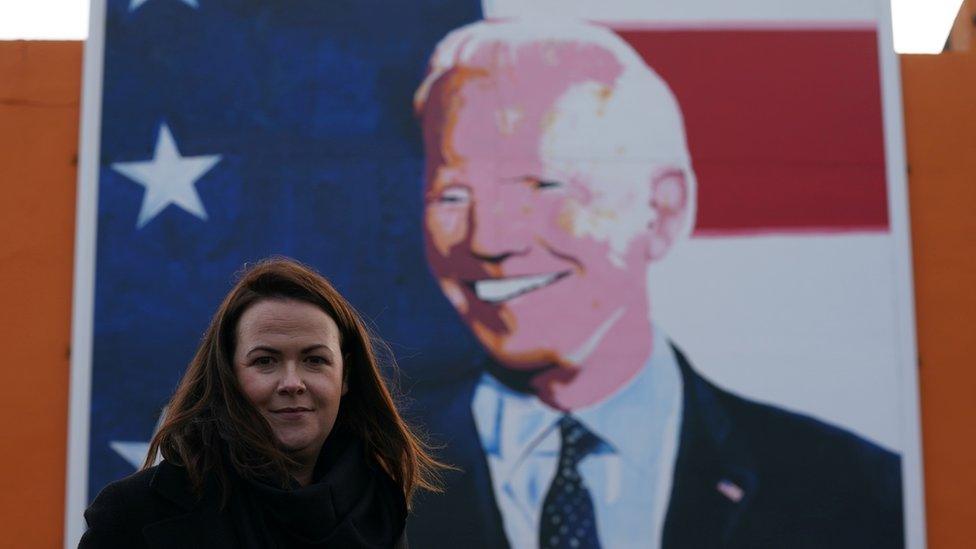 Laurita Blewitt pictured in front of a Joe Biden mural in Ballina