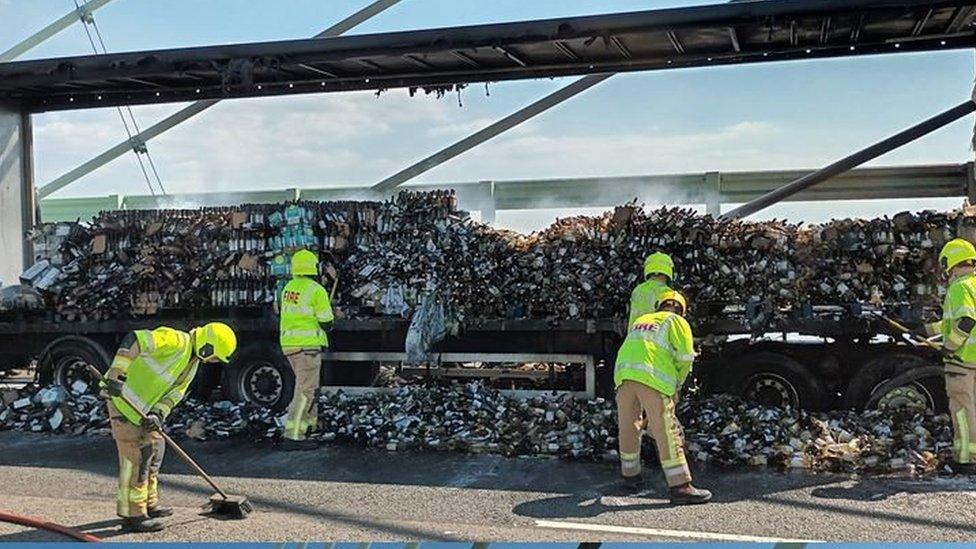 Firefighters cleared up the wine bottles after extinguishing the fire