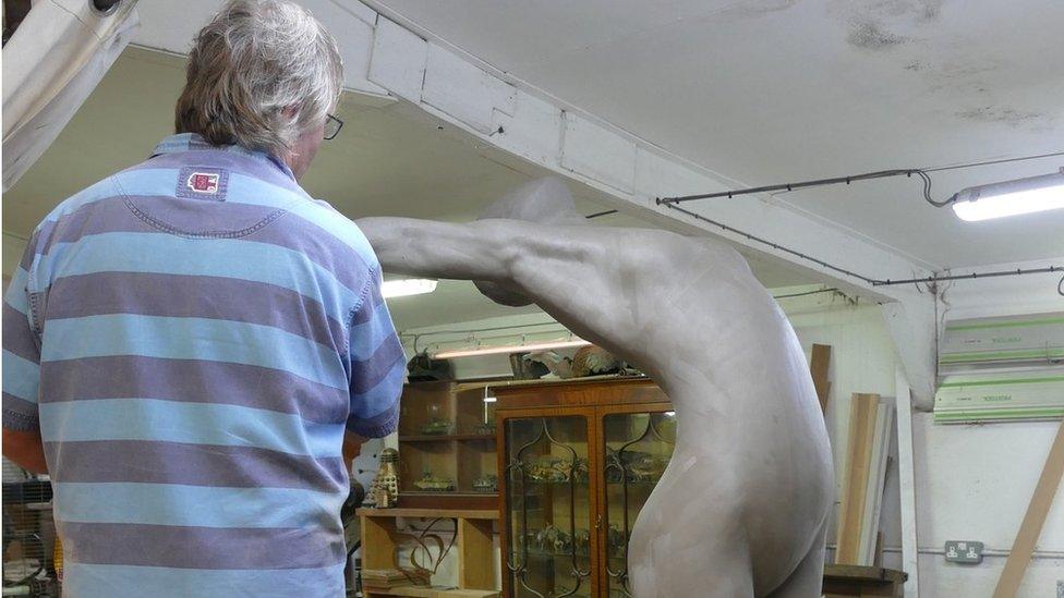 Andrew Sinclair working on one of the three sculptures