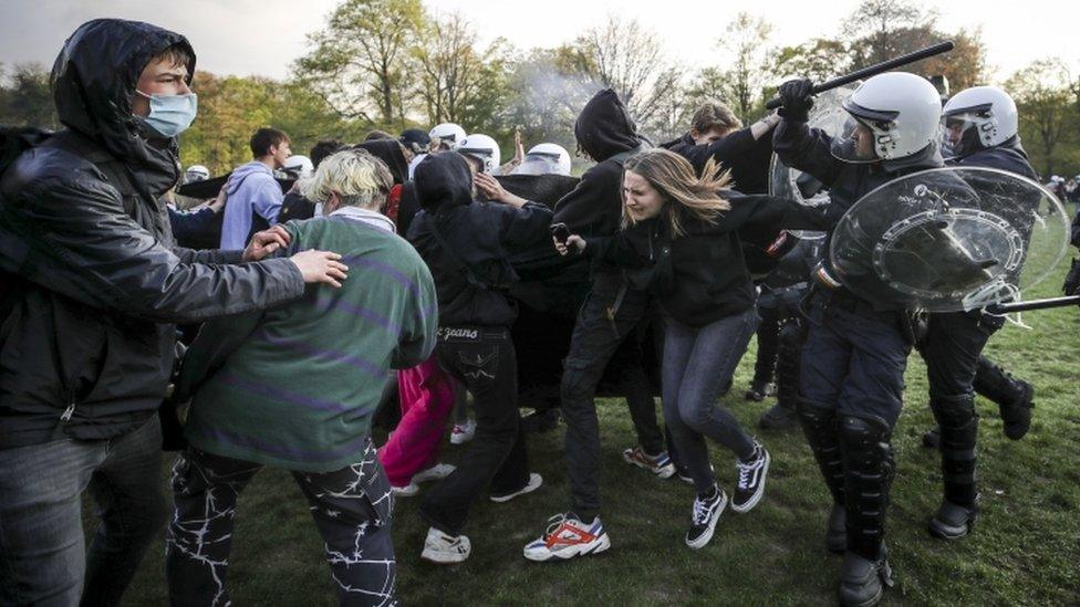 Protesters and police clash during a gathering to protest against the government-imposed anti-Covid measures in Brussels