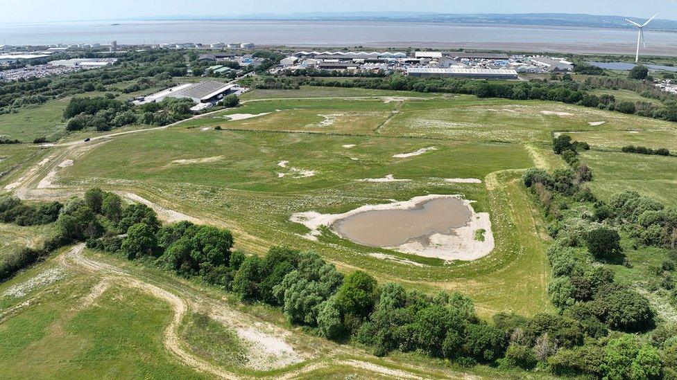 An aerial shot of Hallen Marshes, with the River Severn and Wales visible in the distance