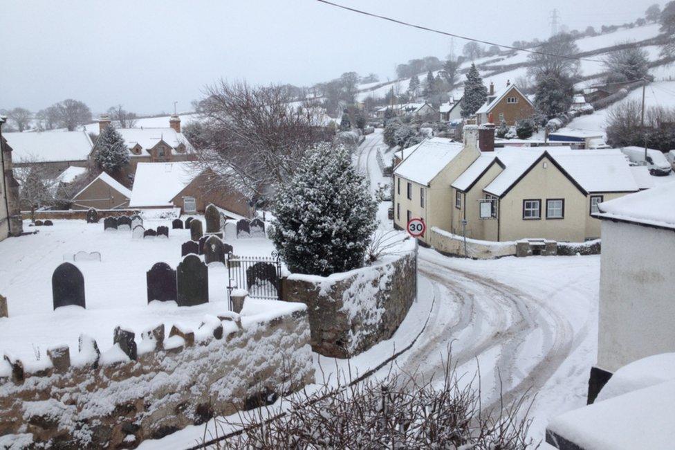 Houses covered in snow