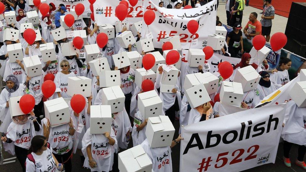 Protesters demanding the abolishment of article 522 of Lebanon's penal code take part in the 14th annual Beirut Marathon on 13 November 2016