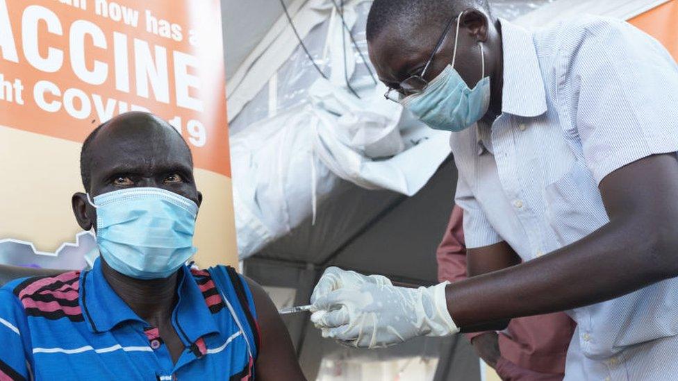 A man being vaccinated in South Sudan