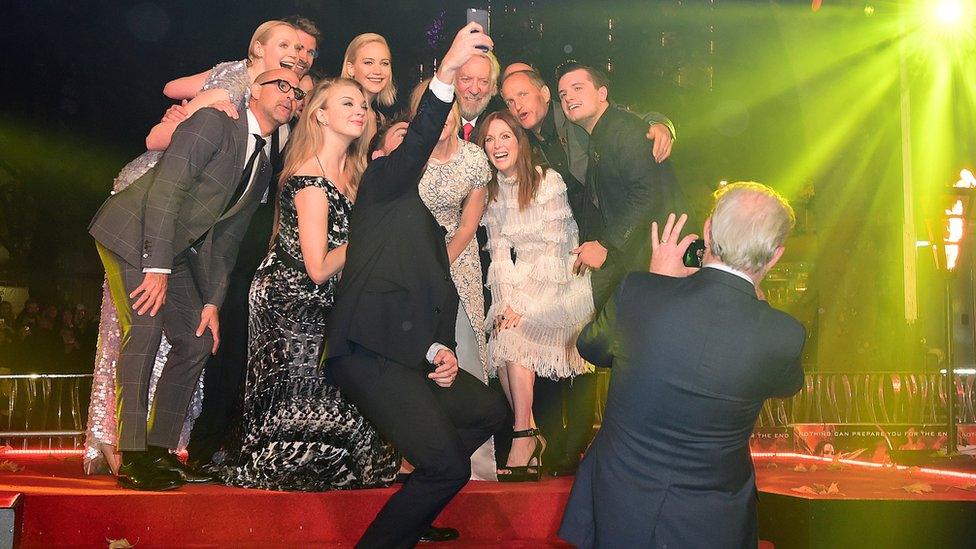 (left to right) Stanley Tucci, Gwendoline Christie, Liam Hemsworth, Natalie Dormer, Jennifer Lawrence, Elizabeth Banks, Donald Sutherland, Julianne Moore, Woody Harrelson and Josh Hutcherson