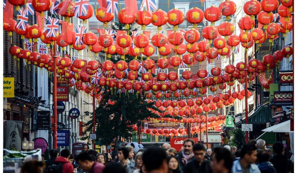 The Union Jack flies alongside the Chinese flag in Chinatown