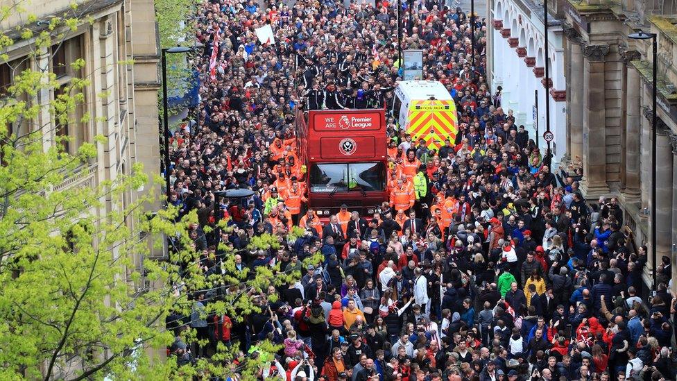 The Sheffield United players and manager Chris Wilder wave to the fans during the promotion parade in Sheffield city centre