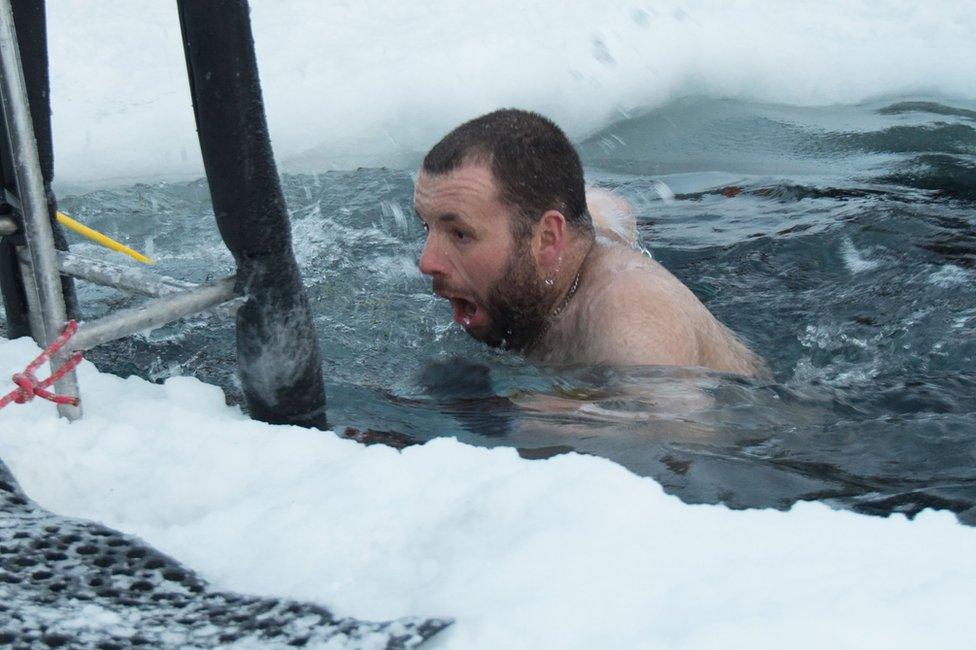 Members of the Australian Antarctic Division (AAD) at the Casey research station swim in icy waters to mark the winter solstice