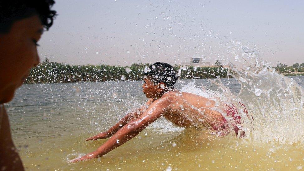 Egyptian boys play in the Ain El-Sira groundwater lake to cool off on a hot summer day at Al-Fustat area in Old Cairo, Egypt, May 16, 2016.
