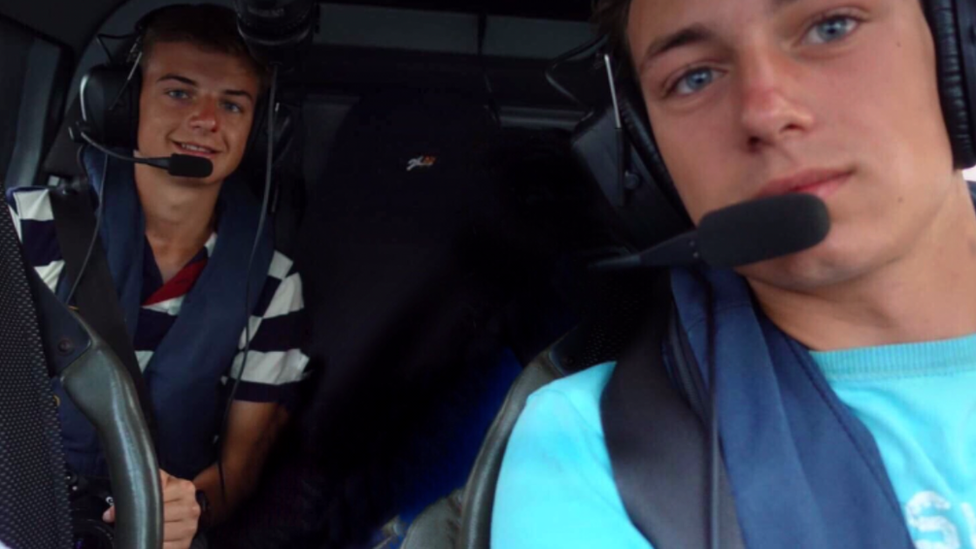 Sam and Ben West pictured in a helicopter