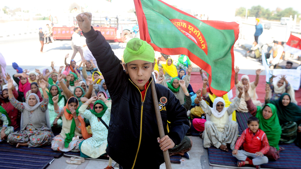 A young boy protesting