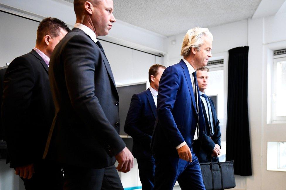 Geert Wilders (centre right) votes in the general election in The Hague, Netherlands, 15 March